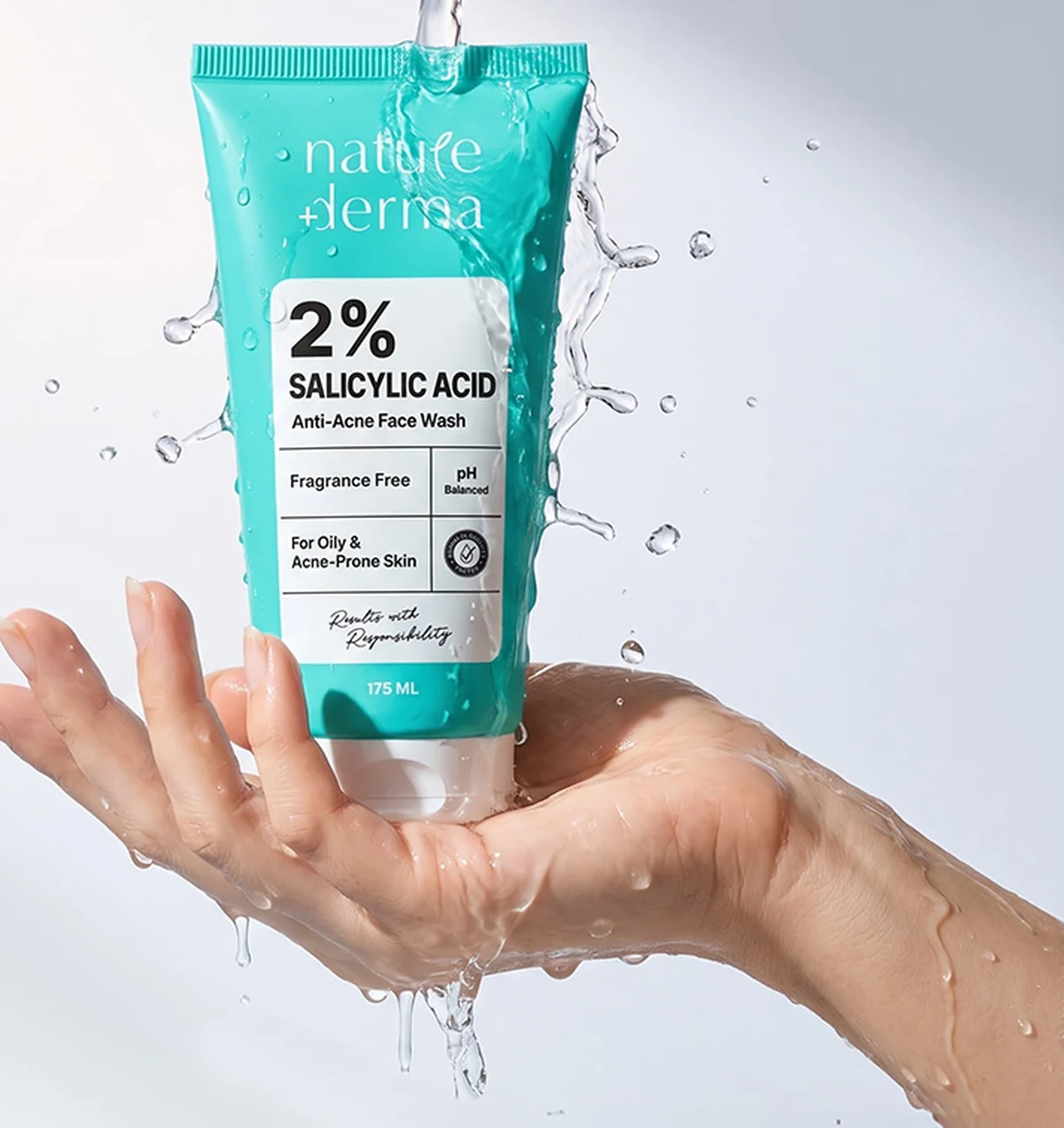 Nature Derma 2% Salicylic Acid Anti-Acne Face Wash held in a hand